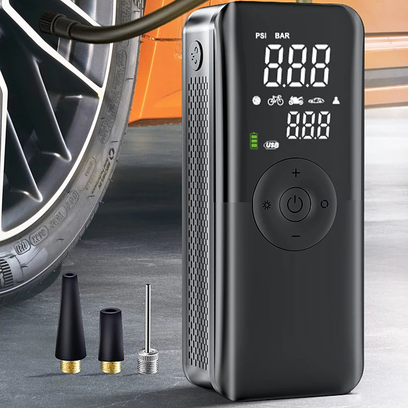 Black tire inflator with digital display and attachments on a concrete surface. CARSUN Cordless Portable Tire Inflator - Rechargeable Air Pump with Digital Display for Cars, Bikes, Balls