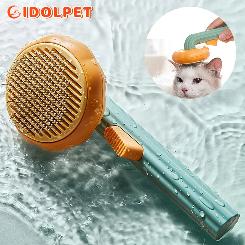 Pet grooming brush with water droplets on a textured background, featuring the brand 'IDOLPET'. Pumpkin Self-Cleaning Pet Brush with Stainless Steel Needles and Ergonomic Silicone Handle for Dogs and Cats Grooming