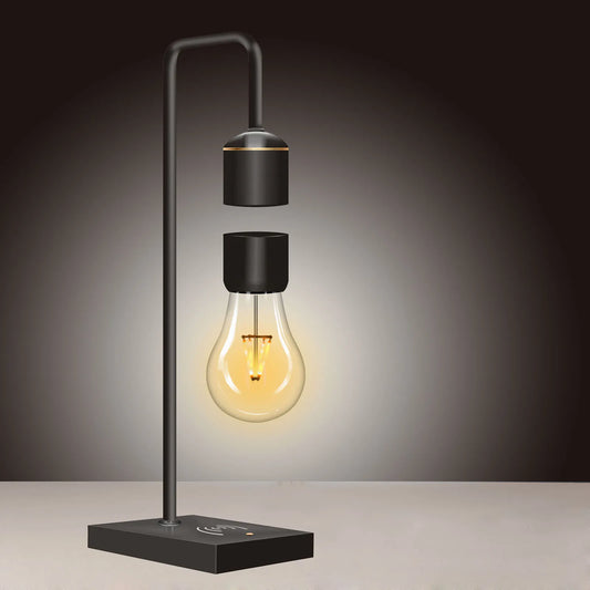 Magnetic levitating wireless LED light bulb hovering over wood base with warm white glow